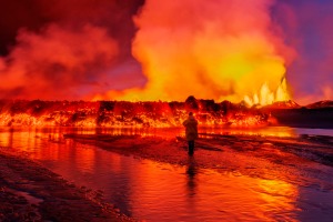 Woman watching the lava flow at the Holuhraun Fissure eruption near Bardarbunga Volcano, Iceland